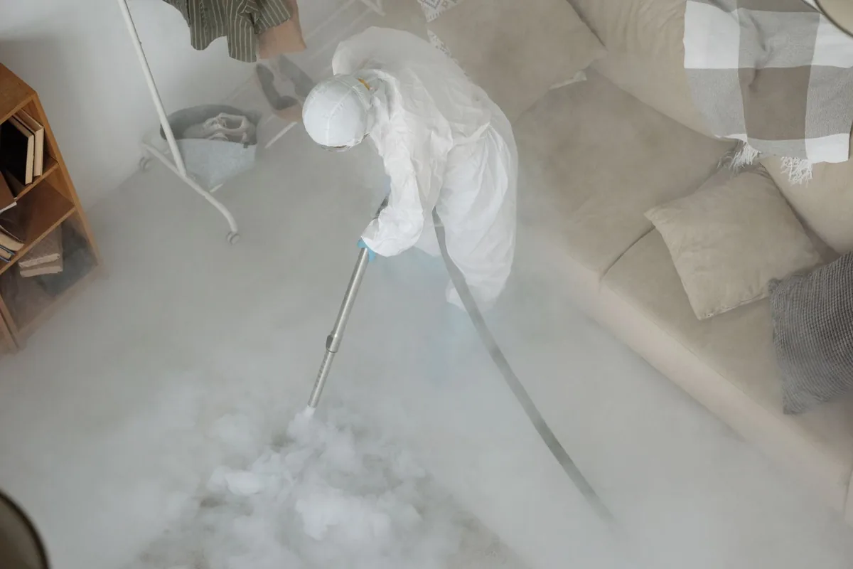 Biohazard cleanup technician in protective equipment, Cedarville, AR